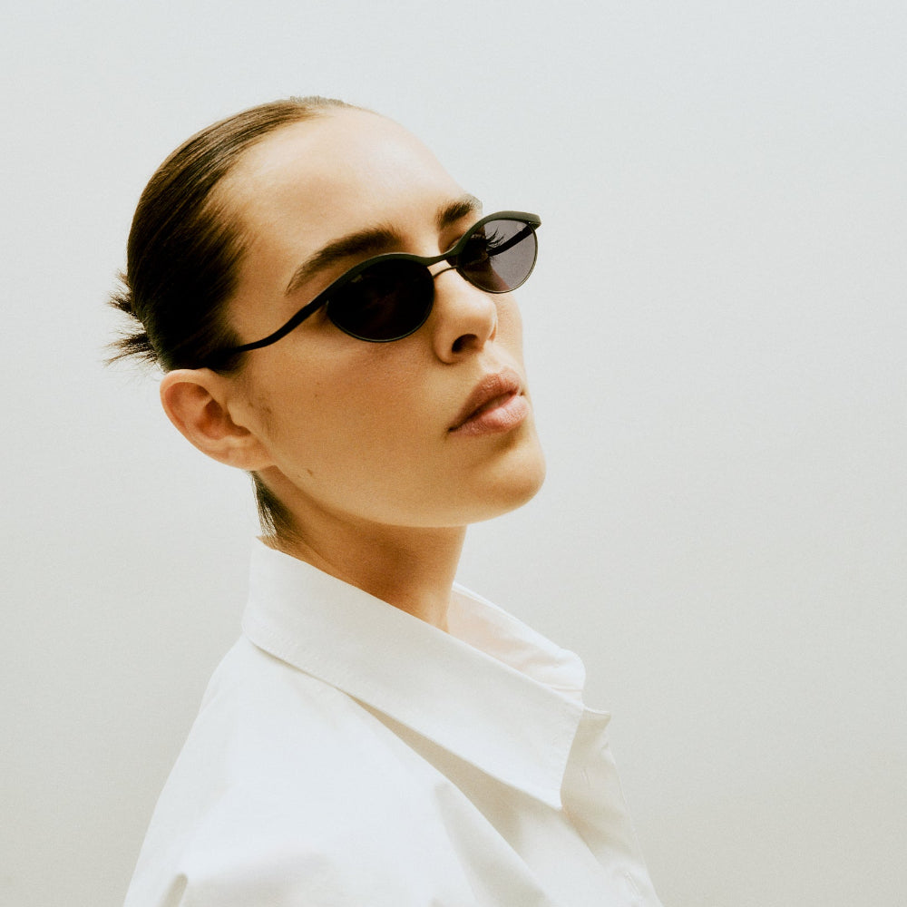 Close-up of Vincent Catani Alma titanium cat-eye sunglasses worn by a model