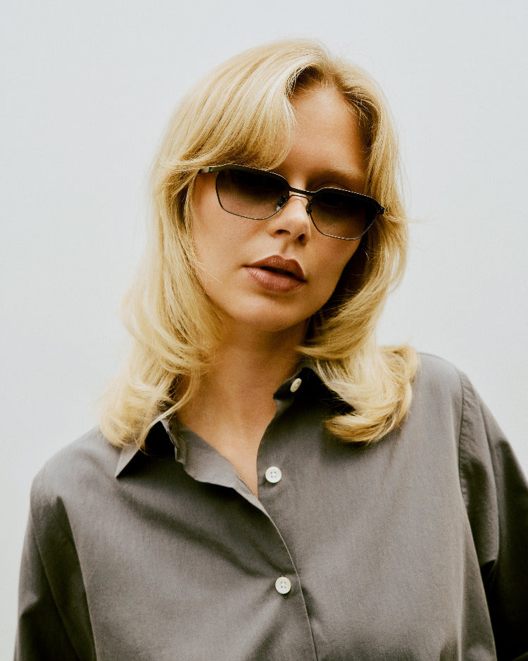 Model wearing Benno frame, exuding subtle strength and modern elegance
