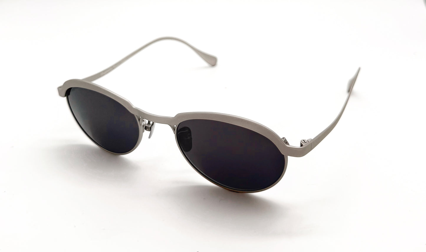 Side view of Vincent Catani Theodor round titanium sunglasses in metal with black lenses