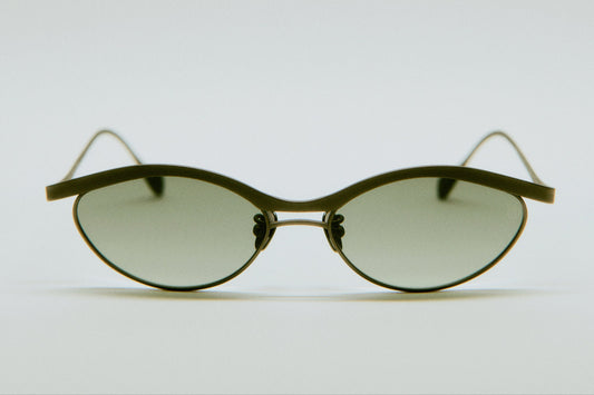 Alma titanium glasses in soft lighting, emphasizing the Japan-made quality finish